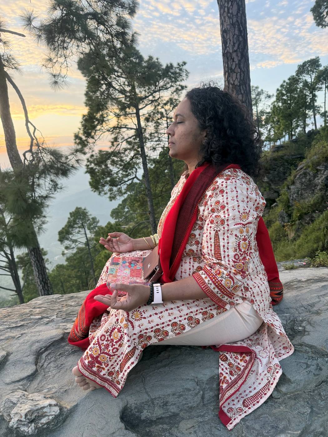 Meditating on a rock at Kasar Devi as the sun sets behind the pines.