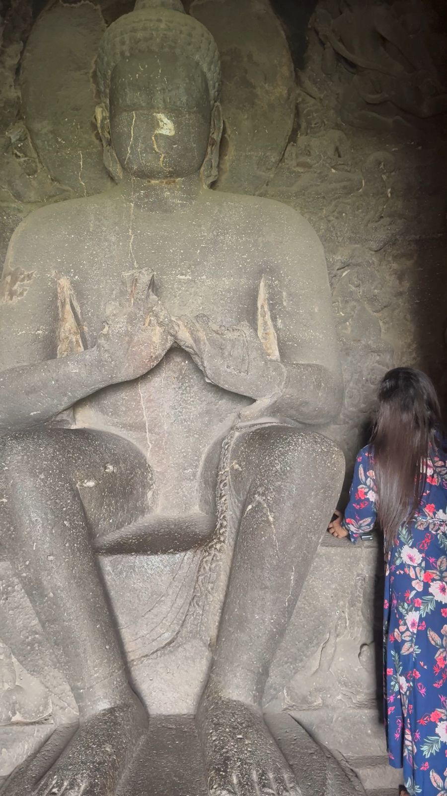 Beside a great seated Buddha carved in the rock at Ellora.