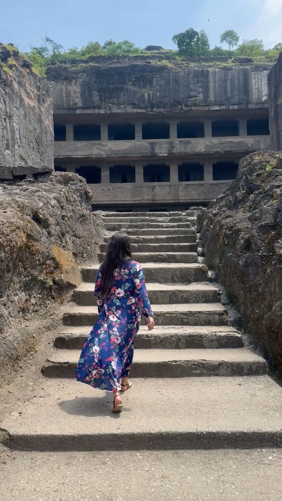 Climbing the stone steps to the caves at Ellora.