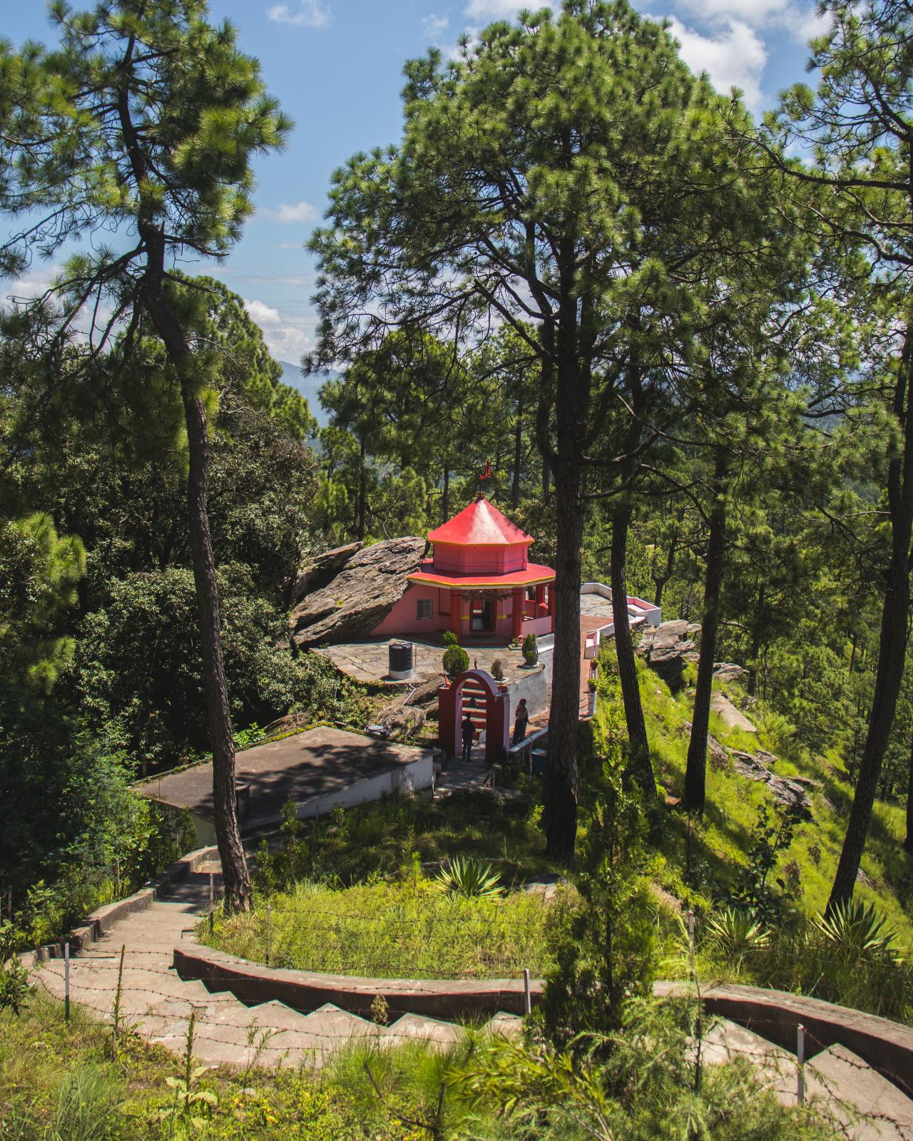 The Kasar Devi temple on its rock among the pines.